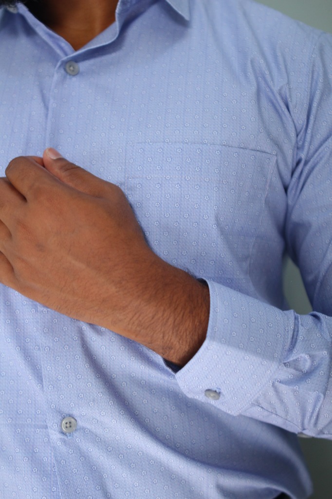 Corporate employee wearing a crisp white RT Premium tailored shirt